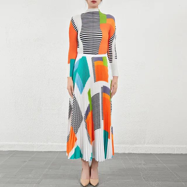 Bold Colored Design 2 Pieces Set of Pleated Long Skirt and a Matching High Collar Long Sleeved Top. Comes in Green and Orange.