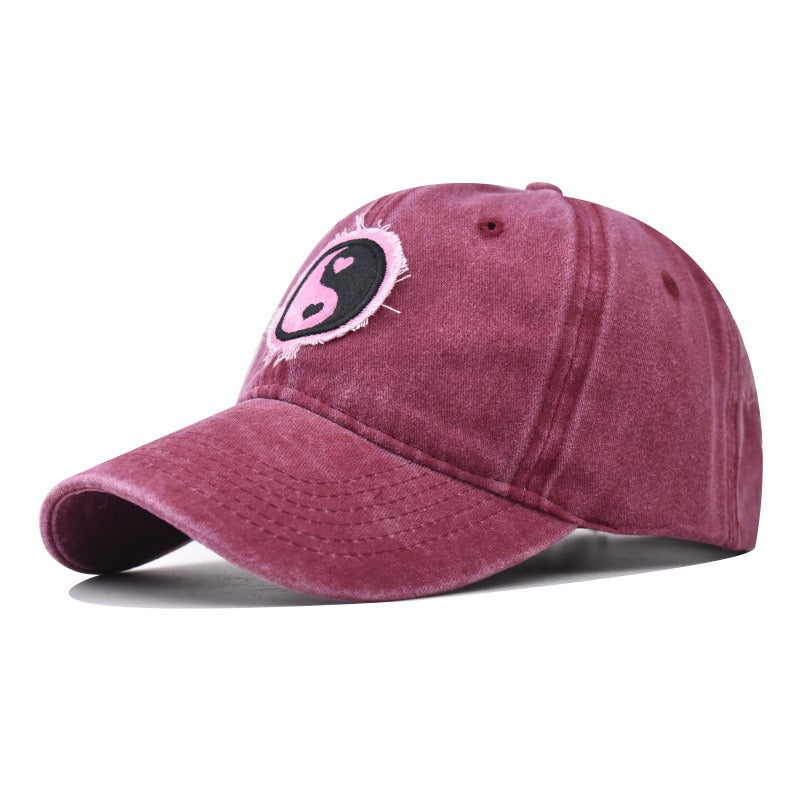 Distressed Pure Cotton  Baseball Cap with an Embroidered Pink and Black Yin-Yang Logo