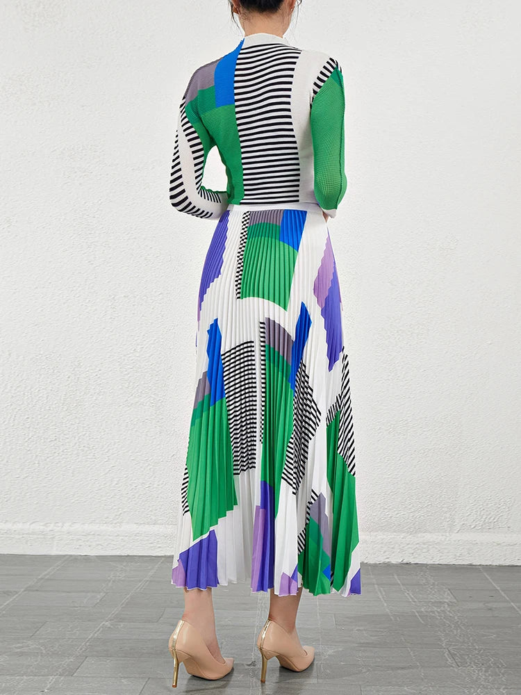 Bold Colored Design 2 Pieces Set of Pleated Long Skirt and a Matching High Collar Long Sleeved Top. Comes in Green  and Orange.