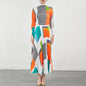 Bold Colored Design 2 Pieces Set of Pleated Long Skirt and a Matching High Collar Long Sleeved Top. Comes in Green  and Orange.