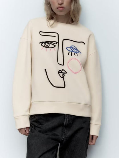 Cool Sweatshirt with an Embroidered Face Design