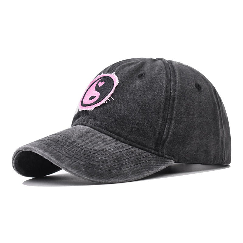 Distressed Pure Cotton  Baseball Cap with an Embroidered Pink and Black Yin-Yang Logo